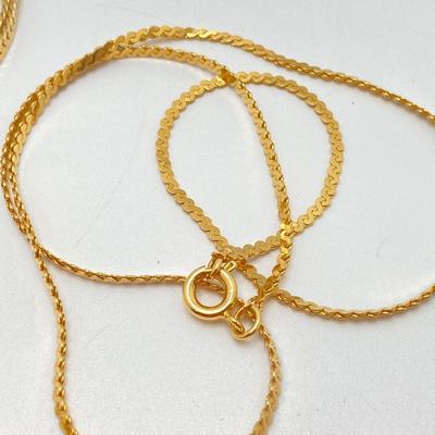 LOT 571: Vintage Jewelry Collection - Lady Nelson Antimagnetic Swiss Made Necklace Watch, Monkey Couple Medallion Necklace and Gold Tone...