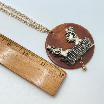 LOT 571: Vintage Jewelry Collection - Lady Nelson Antimagnetic Swiss Made Necklace Watch, Monkey Couple Medallion Necklace and Gold Tone...