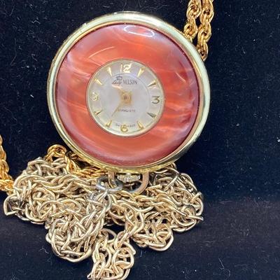LOT 571: Vintage Jewelry Collection - Lady Nelson Antimagnetic Swiss Made Necklace Watch, Monkey Couple Medallion Necklace and Gold Tone...