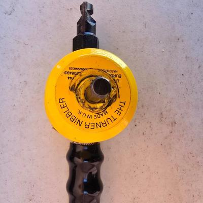 The Rodman Nibbler – Sheet Metal Cutting Tool by Rodman & Company, Inc. with a Gharst & Thomas Pioneer reel tape measure