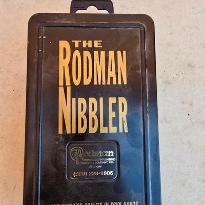 The Rodman Nibbler – Sheet Metal Cutting Tool by Rodman & Company, Inc. with a Gharst & Thomas Pioneer reel tape measure