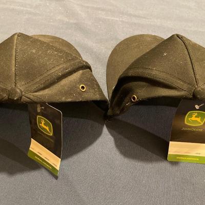 2 black John Deere hats with tags