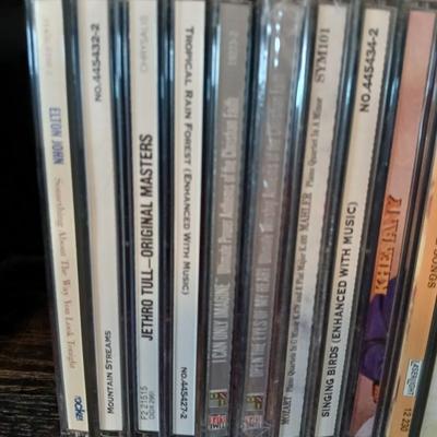 Tall Narrow Black Media Shelf – CD/DVD Storage Tower with an assortment of cd's