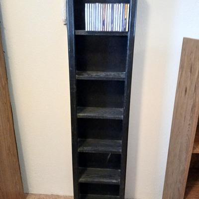 Tall Narrow Black Media Shelf – CD/DVD Storage Tower with an assortment of cd's