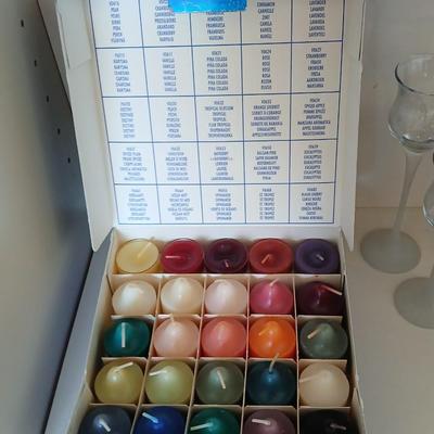 Box of Party lite candles with clear stem glass votives