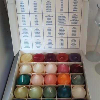 Box of Party lite candles with clear stem glass votives