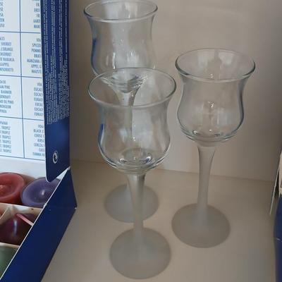 Box of Party lite candles with clear stem glass votives