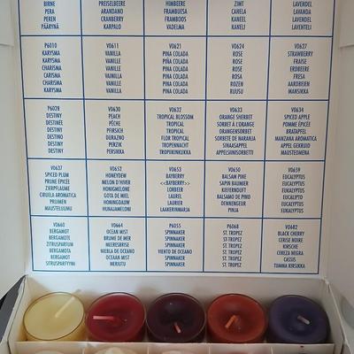 Box of Party lite candles with clear stem glass votives