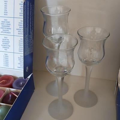 Box of Party lite candles with clear stem glass votives