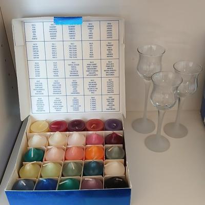 Box of Party lite candles with clear stem glass votives