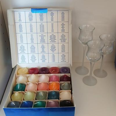 Box of Party lite candles with clear stem glass votives