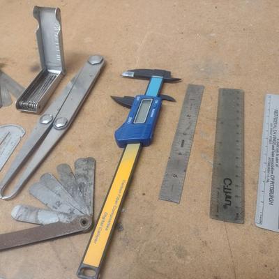 Assortment of Metal Measuring Sticks and Gauges