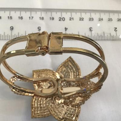 Natasha Couture Rose Rhinestone Clamper Bracelet. Gold Tone