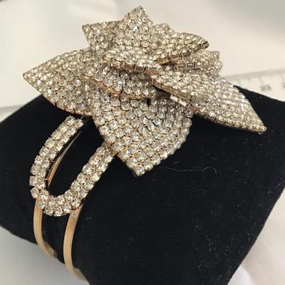 Natasha Couture Rose Rhinestone Clamper Bracelet. Gold Tone