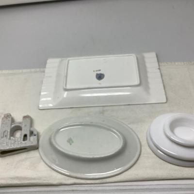 Sale Photo Thumbnail #11: This is a great lot pottery and glass.  You get a nice black and white and orange ashtray, a fish bowl building, restaurant ware oval plate and an Avon milk glass oval soap dish.