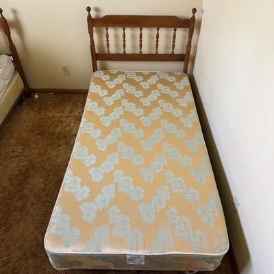 TWIN BED BOX SPRING WITH HEADBOARD AND METAL FRAME ON CASTERS