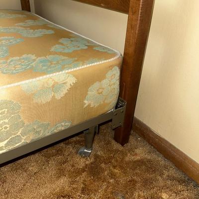 TWIN BED BOX SPRING WITH HEADBOARD AND METAL FRAME ON CASTERS