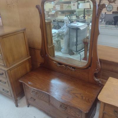 Antique Solid Oak Serpentine Two Over One Dresser with Harnessed Swivel Mirror
