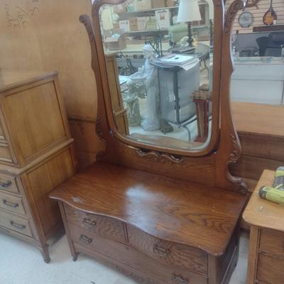 Antique Solid Oak Serpentine Two Over One Dresser with Harnessed Swivel Mirror