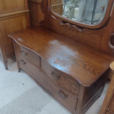Antique Solid Oak Serpentine Two Over One Dresser with Harnessed Swivel Mirror