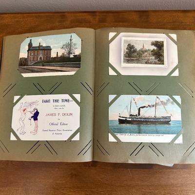 A POSTCARD BOOK FULL OF OLD POSTCARDS