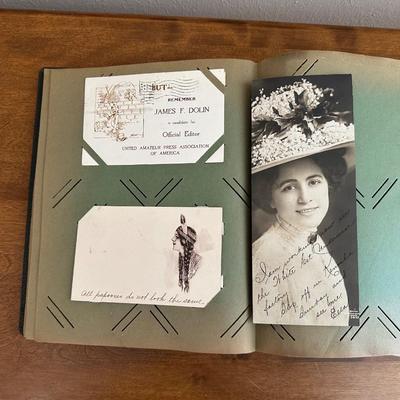 A POSTCARD BOOK FULL OF OLD POSTCARDS