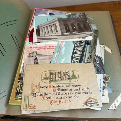 A POSTCARD BOOK FULL OF OLD POSTCARDS