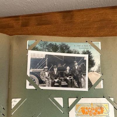 A POSTCARD BOOK FULL OF OLD POSTCARDS