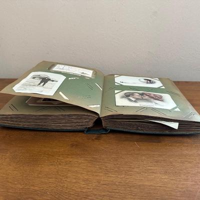 A POSTCARD BOOK FULL OF OLD POSTCARDS