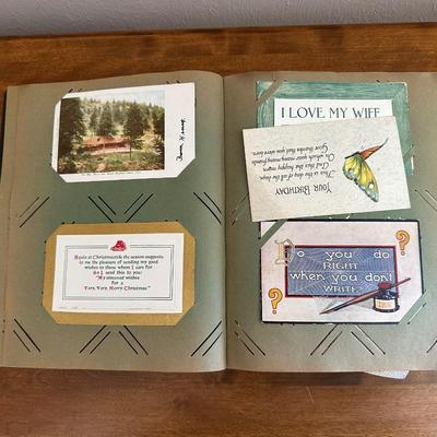 A POSTCARD BOOK FULL OF OLD POSTCARDS