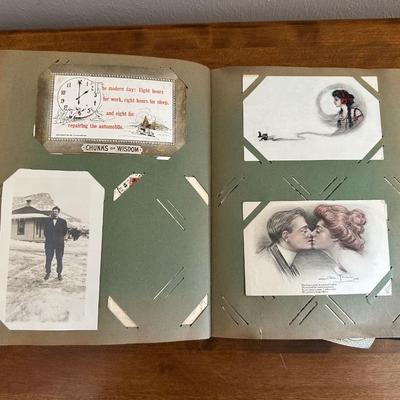 A POSTCARD BOOK FULL OF OLD POSTCARDS
