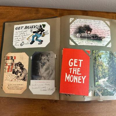 A POSTCARD BOOK FULL OF OLD POSTCARDS