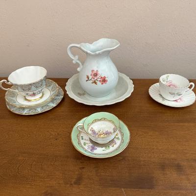 IRONSTONE WASH BOWL AND PITCHER WITH BONE CHINA TEA CUP AND SAUCER