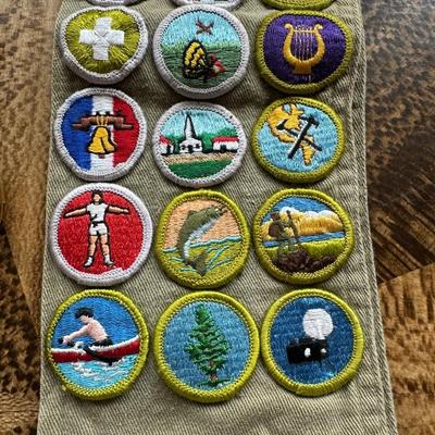 VINTAGE BOY SCOUTS SASH WITH MERIT BADGES, NECKERCHIEF HOLDERS AND WEBELOS TRICOLOR RIBBON WITH PINS