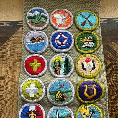 VINTAGE BOY SCOUTS SASH WITH MERIT BADGES, NECKERCHIEF HOLDERS AND WEBELOS TRICOLOR RIBBON WITH PINS