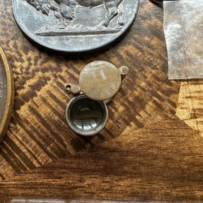 NICE ASSORTMENT OF PATCHES, PINS, VINTAGE MAGNIFYING GLASS LOUPE, METAL COINS AND MORE