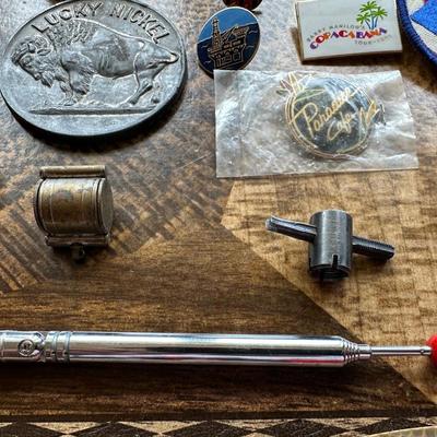 NICE ASSORTMENT OF PATCHES, PINS, VINTAGE MAGNIFYING GLASS LOUPE, METAL COINS AND MORE