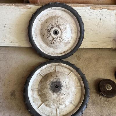SPARE WHEELS, FUNNELS, VINTAGE TAPE MEASURE, VINTAGE FLASHLIGHT AND VINTAGE EAGLE OIL CAN