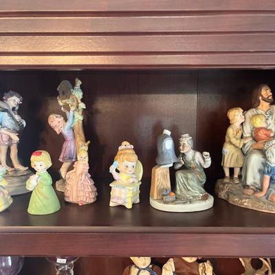 Bookshelf, figurines, and pictures