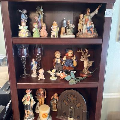 Bookshelf, figurines, and pictures