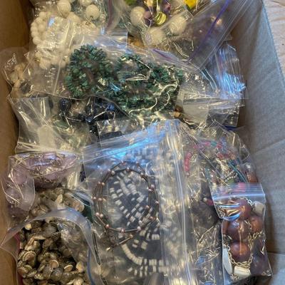 Box full of beaded necklaces
