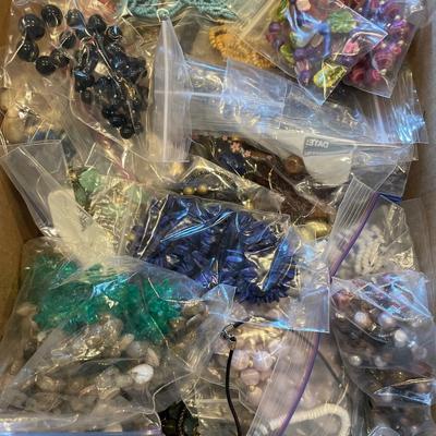 Box full of beaded necklaces