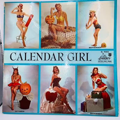 LOT 79: Collection of Vintage Pin-up Girl Posters, Julie London Calendar Girl 1956 Vinyl LP, and a Set of Venus De Milo Salt and Pepper...