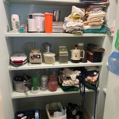 Tupperware, small appliances, kitchen towels and table cloths, cleaning supplies