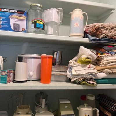Tupperware, small appliances, kitchen towels and table cloths, cleaning supplies