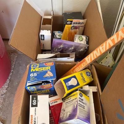 Both Coleman irons, jelly jars, light bulbs, and misc. items