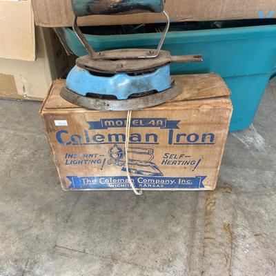 Both Coleman irons, jelly jars, light bulbs, and misc. items