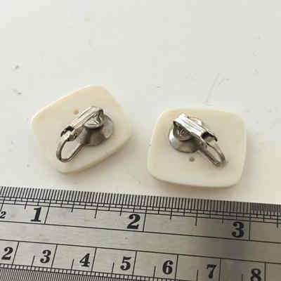 Unmarked vintage white clip on earrings