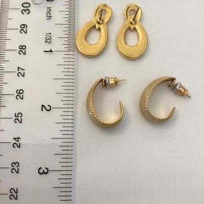 Two pairs of gold, toned cream colored enameled earrings