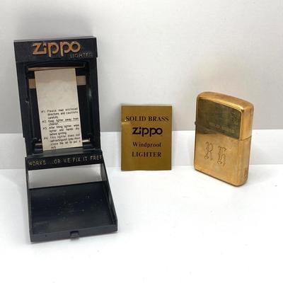 LOT 85: Vintage Lighters and Jewelry - Engraved Brass Zippo, Scripto and Stainless Steel Bracelet